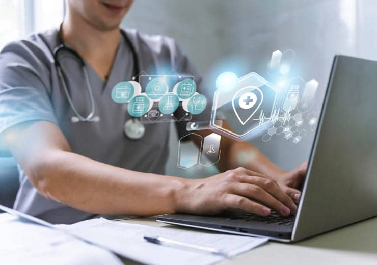 Doctor viewing digital health records on a laptop