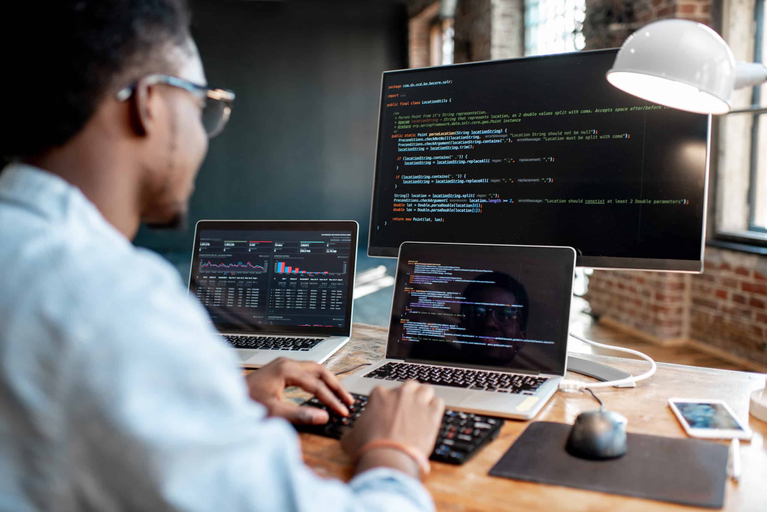 Programmer working with program code express js development services
