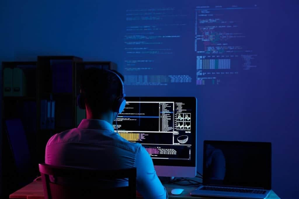 Man working on computer focused on Golang web development